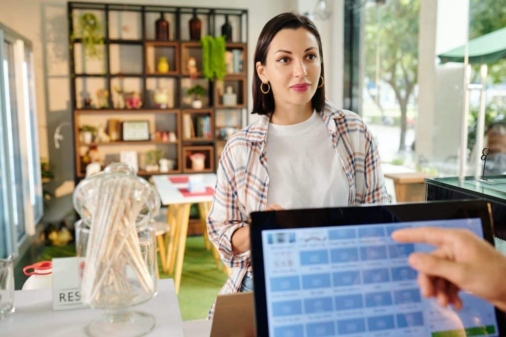 woman making order in cafe